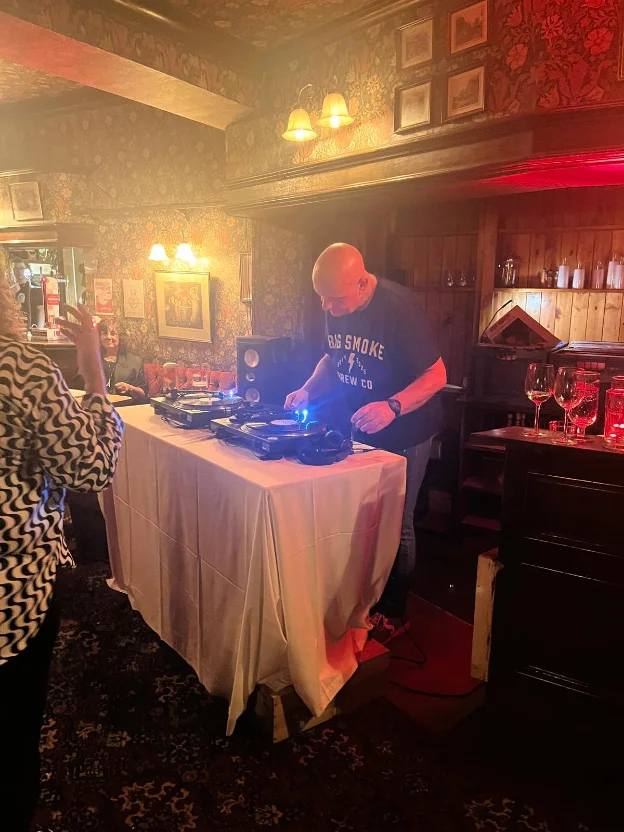 DJ Curly on the decks at a pub night